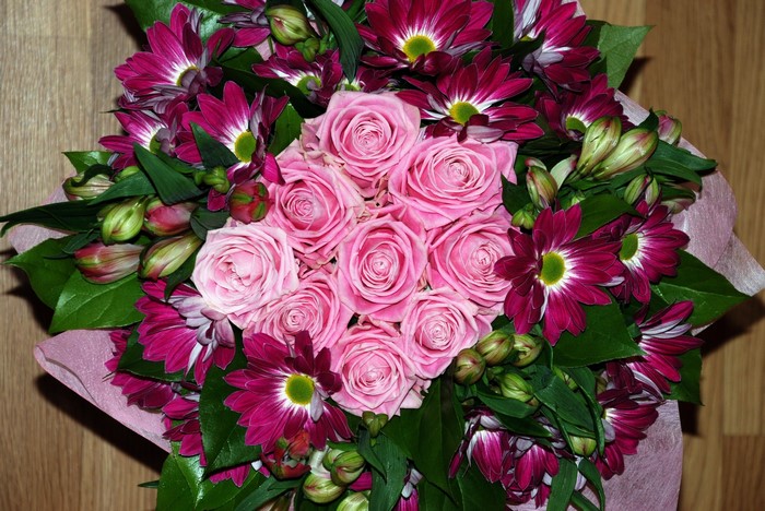 Pink roses and purple daisies bouquet