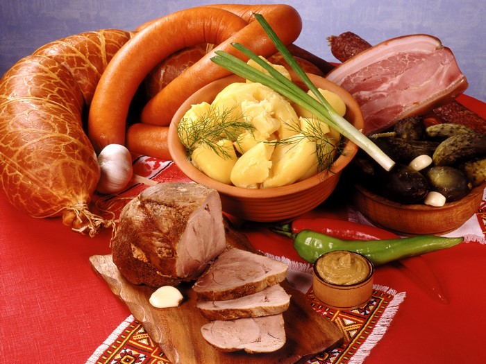 Meat products and sausages with potatoes and pickles