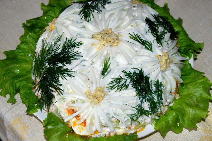 Salad decorated with egg flowers and dill