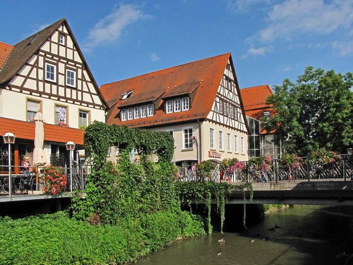 Half-timbered houses and a bridge over a canal in Germany