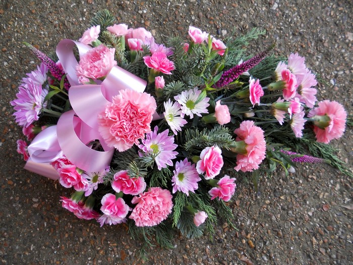 Pink and purple flowers with a pink ribbon