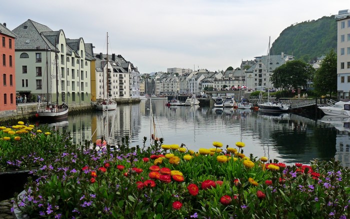 Alesund, Norway canal with colorful buildings and boats