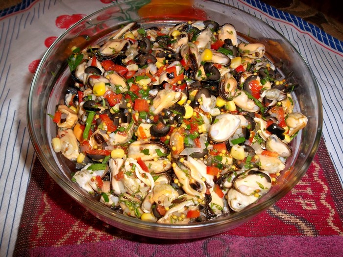 Mussel salad with corn, olives, and tomatoes