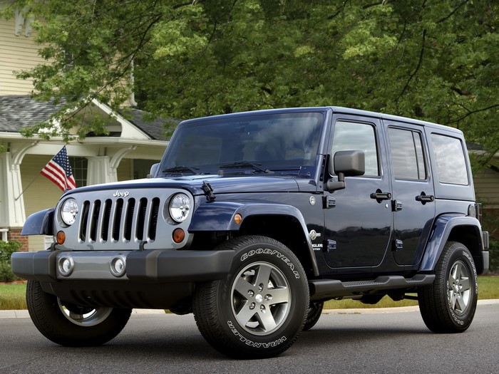 Dark Blue Jeep Wrangler parked in front of a house
