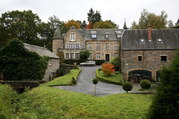 Stone castle with a car in Belgium
