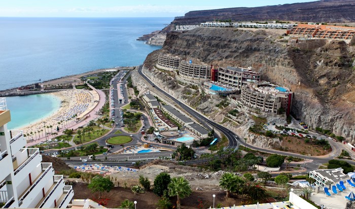 Coastal resort with beach and hotels on cliffs in Spain