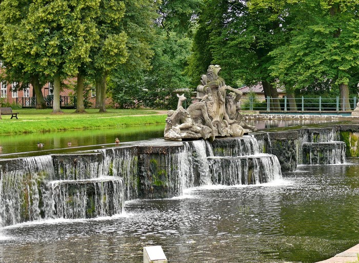 Sculpture and waterfall in a park