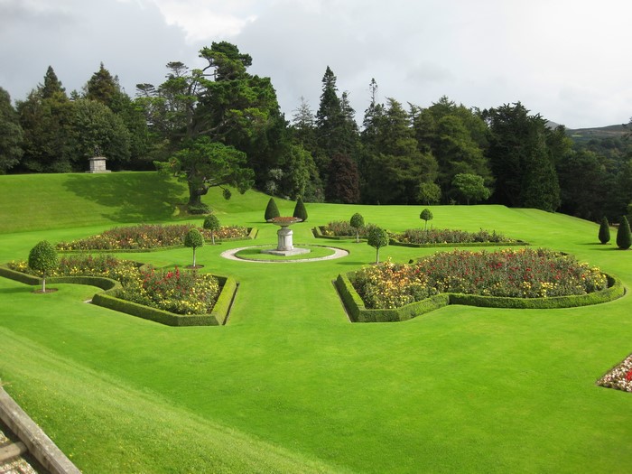 Formal gardens with rose beds and manicured trees