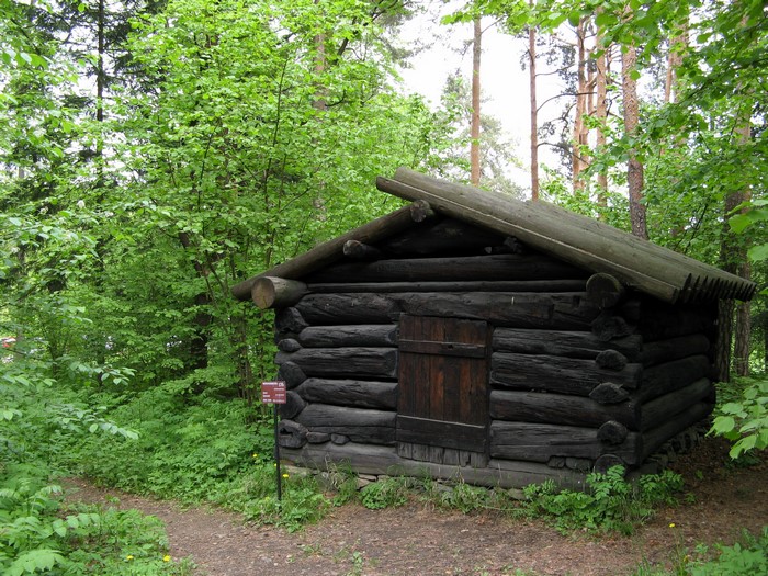 Log cabin in a forest at Norwegian Folk Museum