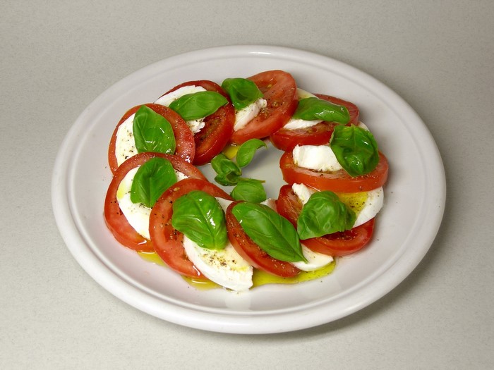 Caprese salad with tomatoes, mozzarella, and basil
