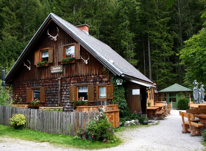 Wooden mountain hut with deer antlers in Austria