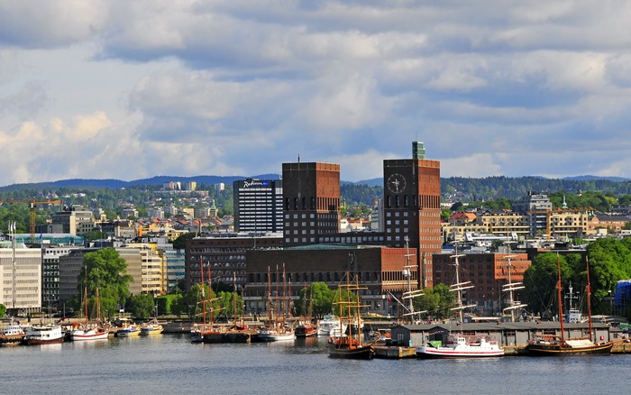 Oslo City Hall and harbor with sailboats, Norway