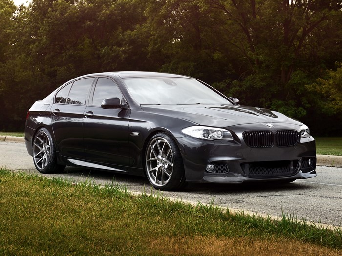 Dark BMW Sedan on Paved Road