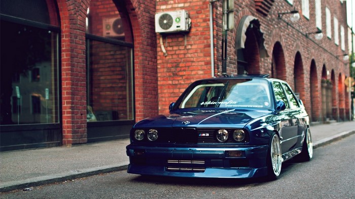 Blue BMW M3 parked on a street