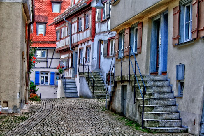 Cobblestone alley with historic German half-timbered houses