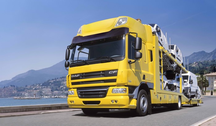 Yellow DAF CF 75 360 car carrier truck