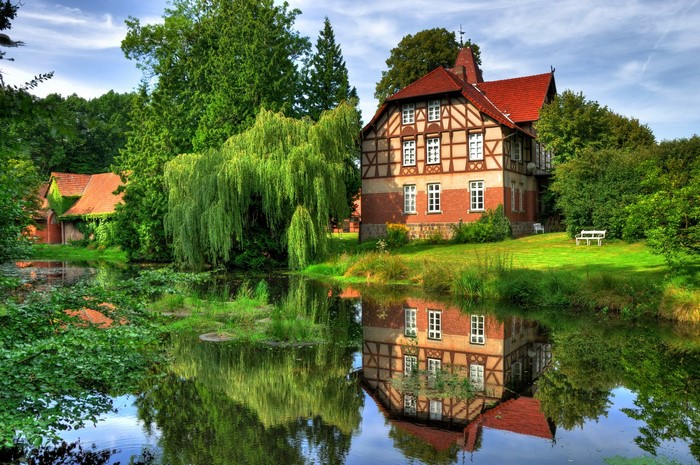 Half-timbered house by a pond in Germany