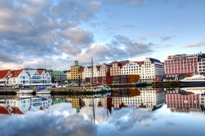 Buildings reflecting in water in Norway