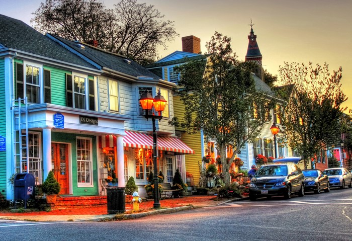 Street scene in Marblehead, USA with shops and cars