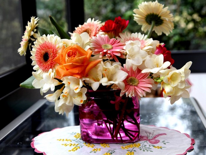 Bouquet of Roses and Gerbera Daisies in a Pink Vase