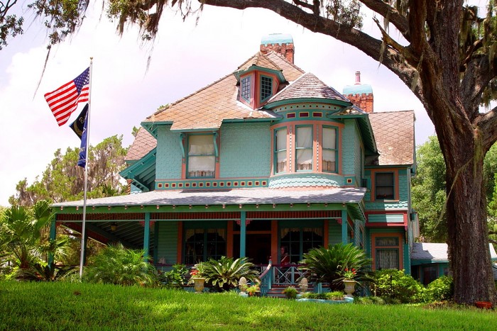 Victorian House with American Flags