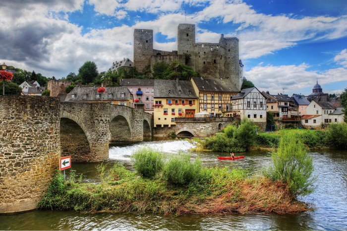 Castle and bridge over a river in Germany