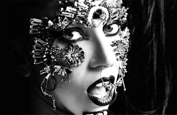 Woman with elaborate metallic face jewelry