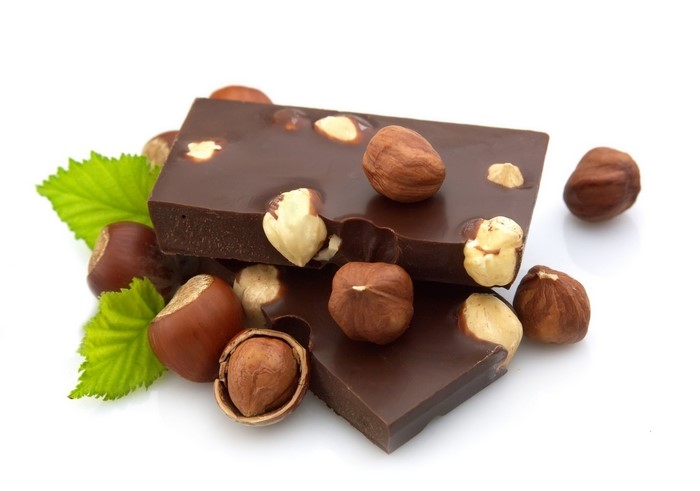 Chocolate bar with hazelnuts and leaves
