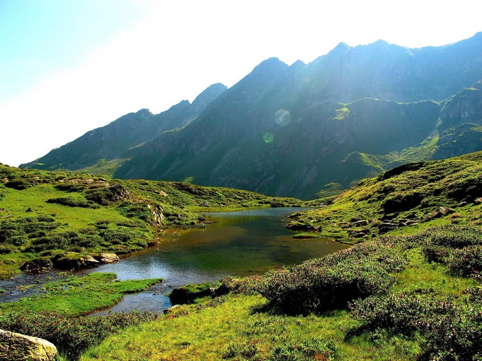 Mountains and a lake in a green valley