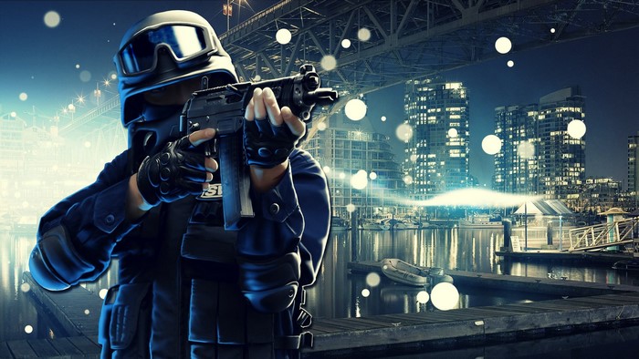 SWAT operative aiming a rifle in a city at night