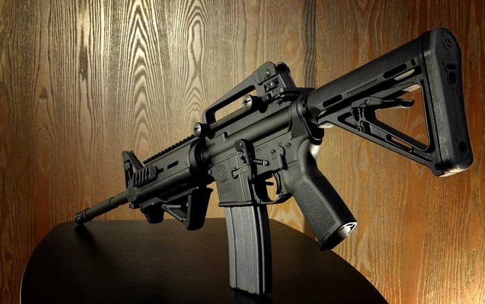 Black AR-15 style assault rifle with magazine