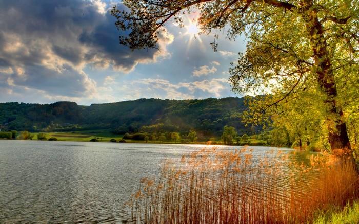 Lake with Trees and Hills at Sunset