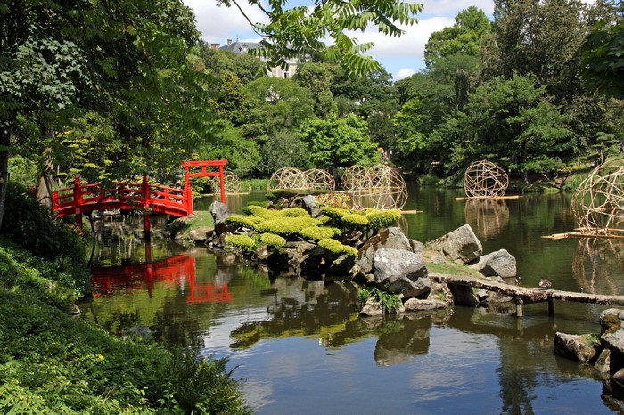 Japanese Garden with Red Bridge and Sculptures