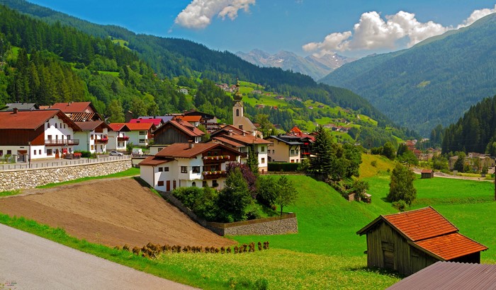 Alpine village with church in Austria