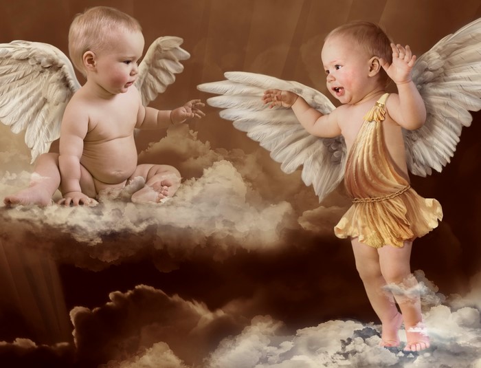 Two babies with wings sitting on clouds