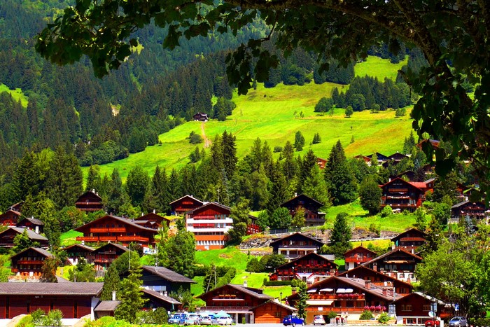 Swiss village nestled in a green mountain valley