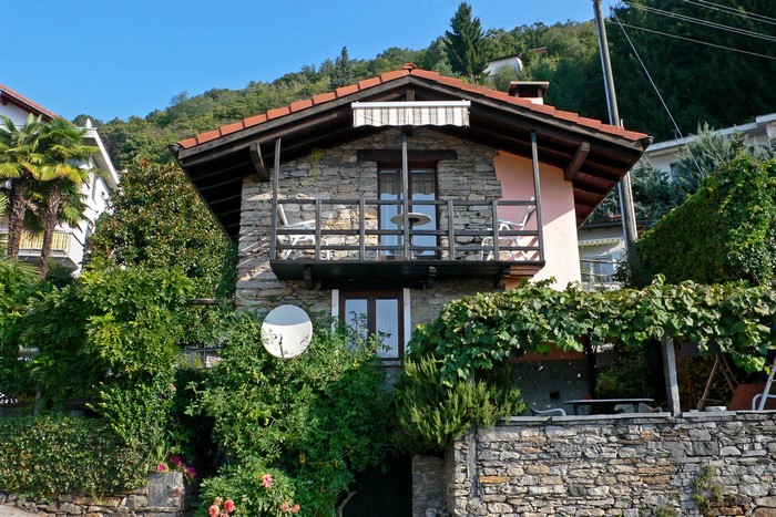 Stone house with balcony in Ticino, Switzerland
