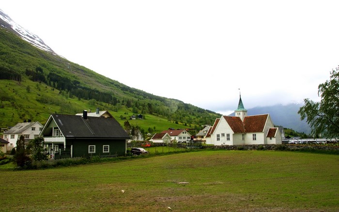 Village with church and houses in Norway