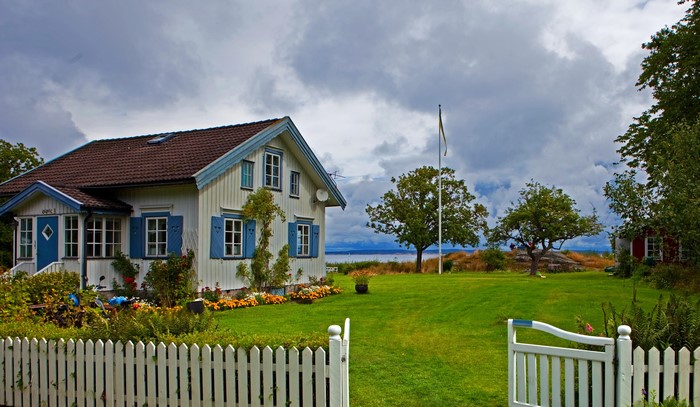 White house with blue shutters in Sweden
