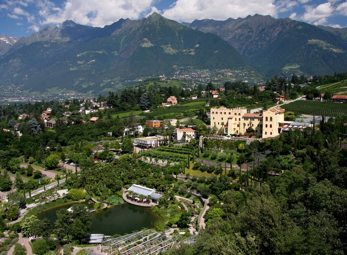 Castle surrounded by gardens and mountains in Italy