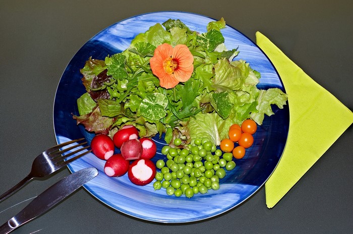 Salad with Nasturtium Flower, Radishes, Peas, and Tomatoes