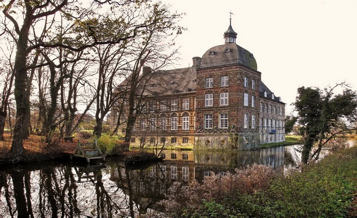 Castle Hovestadt in Germany surrounded by water and trees