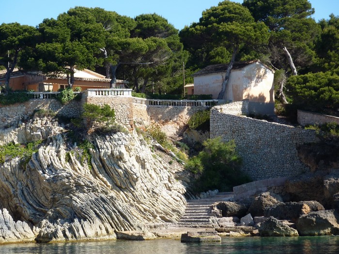 Houses on a rocky cliffside in Majorca, Spain