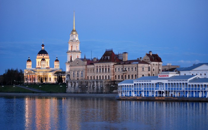 Rybinsk cityscape with cathedral and river at dusk