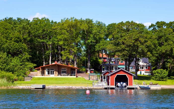 Houses and boathouse on a lake in Sweden