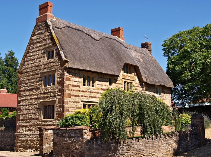 Thatched roof stone cottage in the United Kingdom