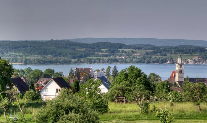 Village with church and lake in Germany