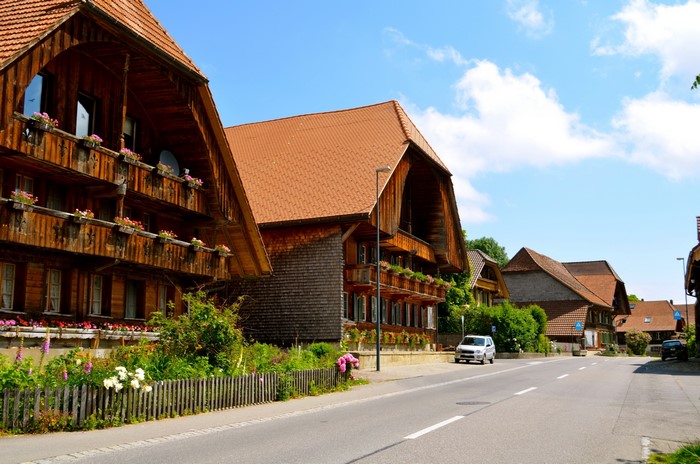 Traditional wooden houses on a street in Rueggisberg, Switzerland