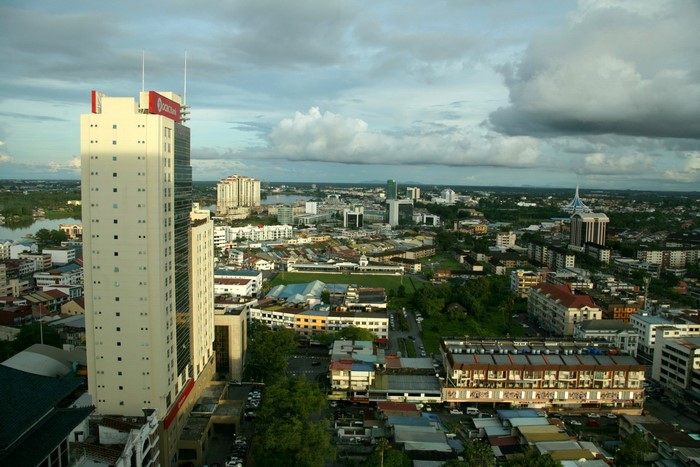 Cityscape with tall buildings and river in Malaysia