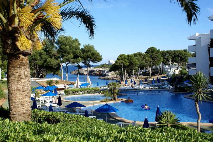 Resort pool and beach in Santanyi, Majorca, Spain
